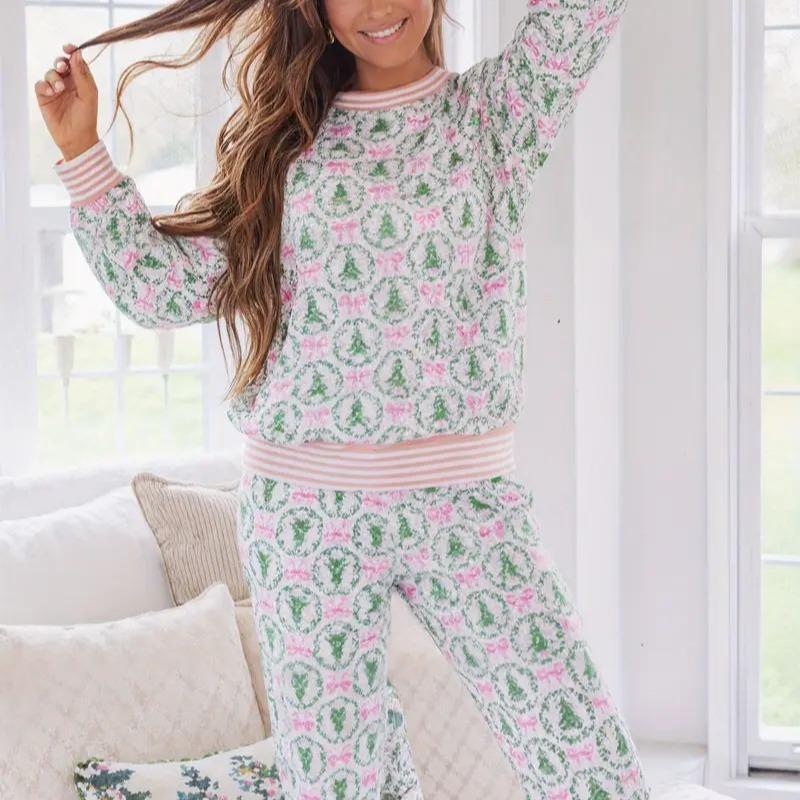 Woman wearing a floral pajama set in a bright room.